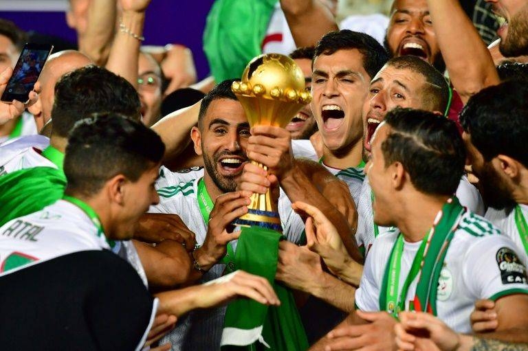 Algeria captain Riyad Mahrez (C) and teammates celebrate winning the Africa Cup of Nations in Cairo this month. — AFP/File
