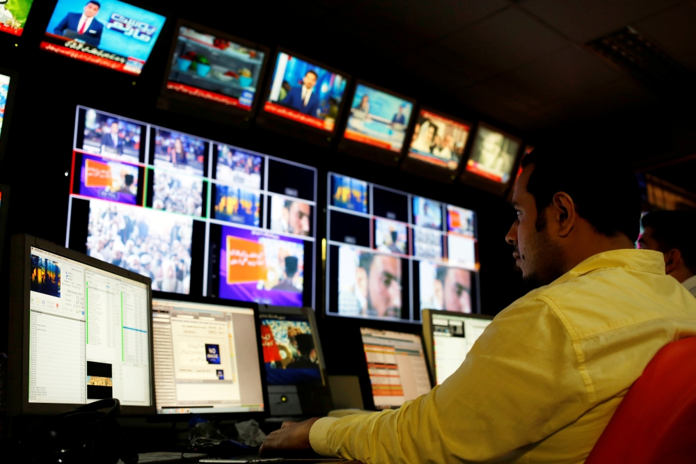 An employee works at the control room of the Geo News television channel in Karachi, Pakistan, in this April 11, 2018 file photo. — Reuters