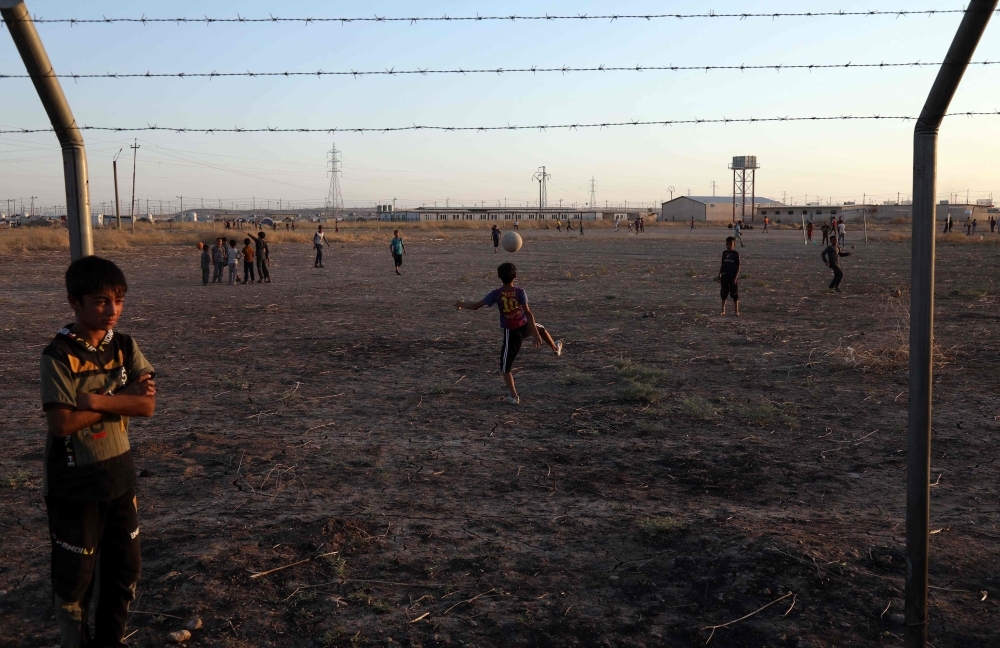 Displaced Iraqis play football at Al-Khazir camp for the internally displaced, located between Arbil and Mosul, in this July 30, 2019 file photo. — aFP