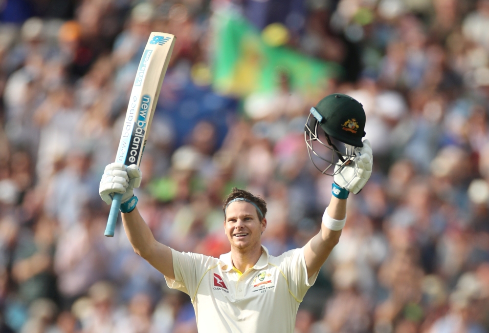 Australia's Steve Smith celebrates his century against England in the first Test at Edgbaston, Birmingham, Britain, on Thursday. — Reuters