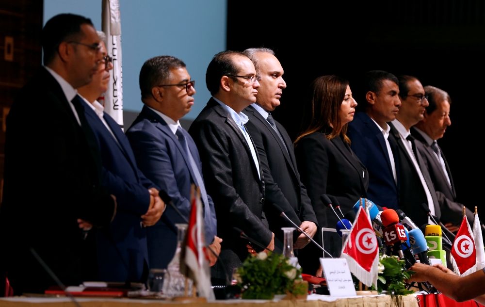 Members of Tunisia's independent electoral committee (ISIE) stand during a minute of silence in memory of Tunisian President Beji Caid Essebsi, who died last week, before a news conference in Tunis, Tunisia, in this July 30, 2019 file photo. — Reuters