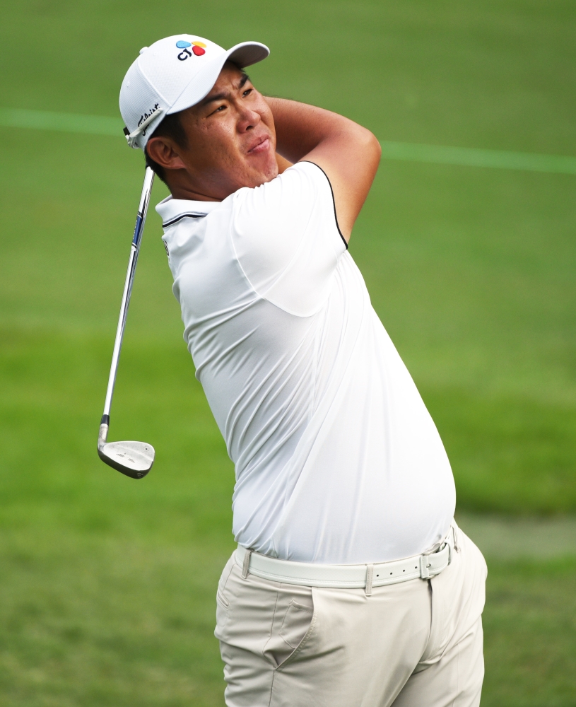 An Byeong-hun hits his approach shot on the ninth hole during the second round of the Wyndham Championship golf tournament at Sedgefield Country Club, Greensboro, NC, USA, on Friday. — Reuters