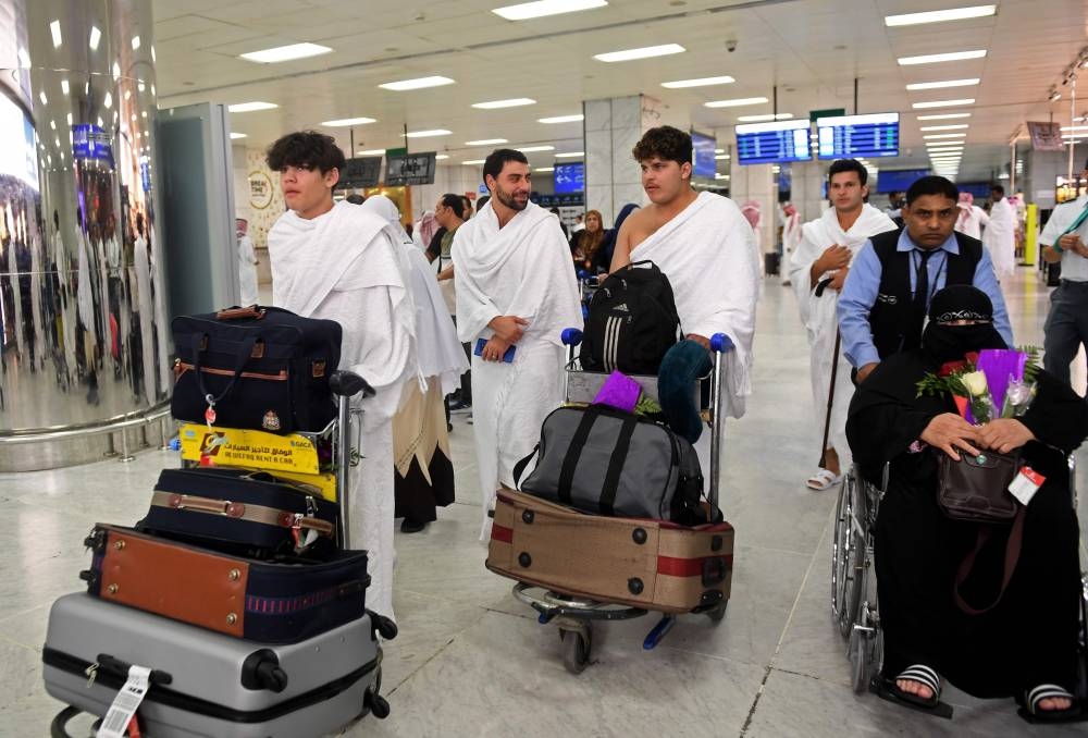 Families of victims of the March 2019 attack on mosques in New Zealand, arrive at Jeddah airport on Friday, prior to the start of the annual Haj pilgrimage in the holy city of Makkah.  