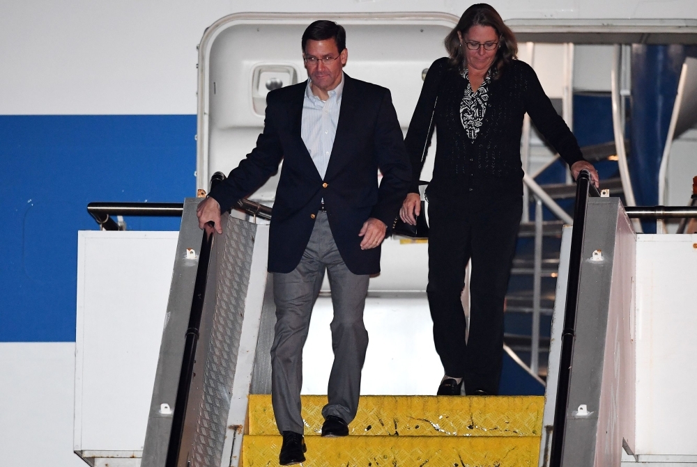 US Defense Secretary Mark Esper and his wife Leah arrive at Sydney Airport, Saturday. — AFP