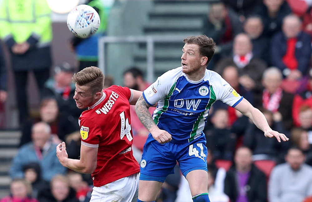 In this file photo taken on Ashton Gate Stadium, Bristol, Britain - April 6, 2019, Wigan Athletic's Joe Garner in action with Bristol City's Adam Webster. — Courtesy photo