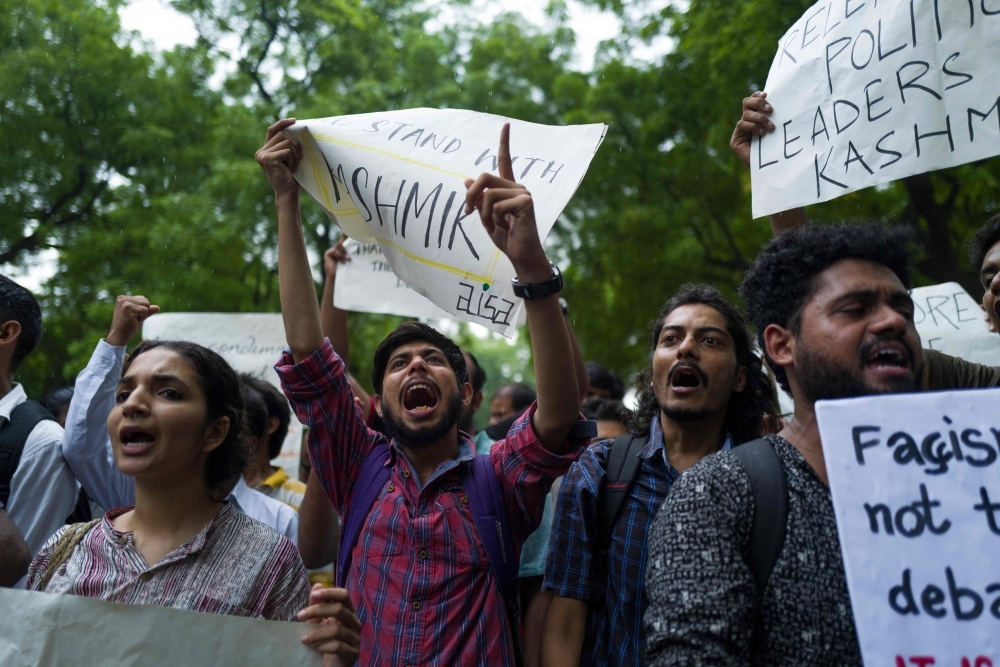 Activists and supporters of Indian left wing parties shout slogans during a demonstration to protest against the presidential decree abolishing Article 370 of the constitution giving special autonomy to Muslim-majority Kashmir, in New Delhi on Monday. — AFP