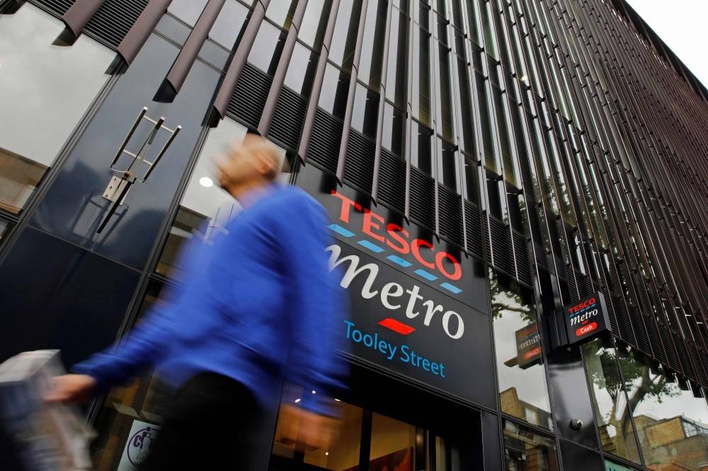 A man walks past a Tesco Metro store in central London on August 5, 2019. — AFP

