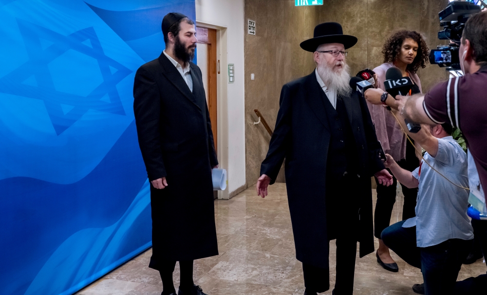 Israeli Deputy Health Minister Yaakov Litzman speaks to members of the media before he enters the offices of Israeli Prime Minister Benjamin Netanyahu to attend the weekly Cabinet meeting in Jerusalem in this May 26, 2019 file photo. — Reuters