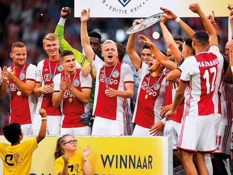 Ajax Amsterdam’s players celebrate after winning the Dutch Super Cup football final match between Ajax Amsterdam and PSV Eindhoven at the Johan Cruijff Arena in Amsterdam. — AFP