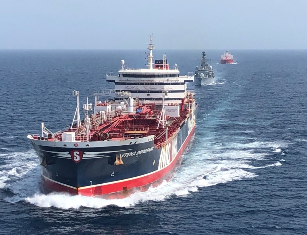 A handout picture taken on and released by the British Ministry of Defense on July 25, 2019 shows the HMS Montrose, center, accompanying the Stena Important, left, and the Sea Ploeg vessels in the Gulf. — AFP