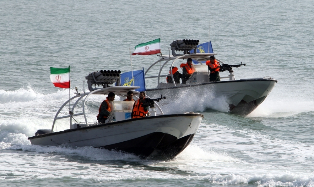 Iranian Revolutionary Guards drive speedboats at the port of Bandar Abbas in this July 2, 2012 file photo. — AFP