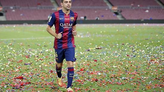 In this file photo taken on May 23, 2015, Barcelona's Xavi Hernandez runs towards his family after their Spanish first division soccer match against Deportivo de la Coruna at Camp Nou stadium in Barcelona, Spain. — Reuters