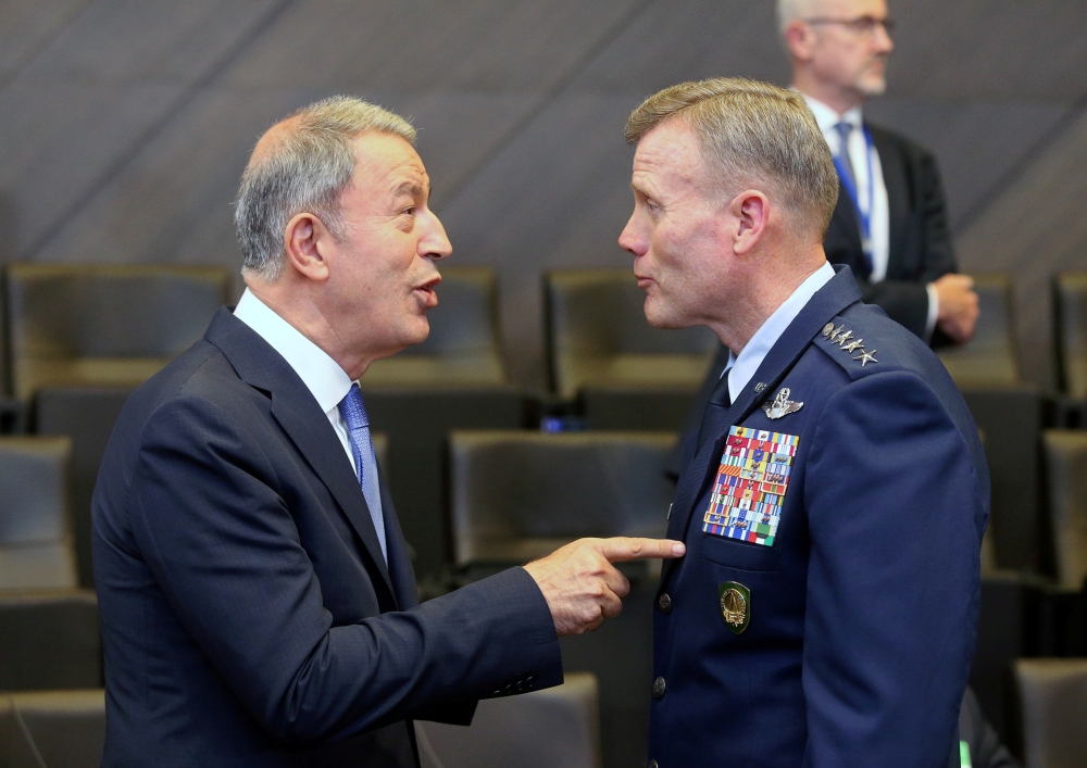 Turkish Defense Minister Hulusi Akar, left, and the Supreme Allied Commander Europe, US Air Force General Tod Wolters, speak at a NATO meeting in Brussels, Belgium, in this June 26, 2019 file photo. — Reuters