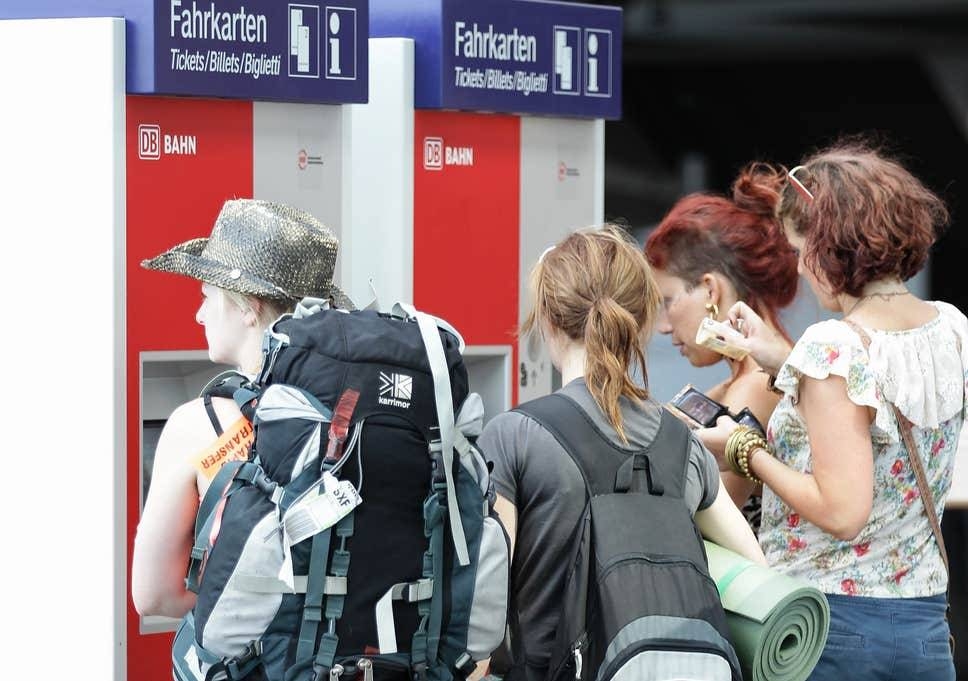 Backpackers queue up at a ticket machine at Hauptbahnhof train station in Berlin, Germany, in this file picture. — Courtesy photo 
