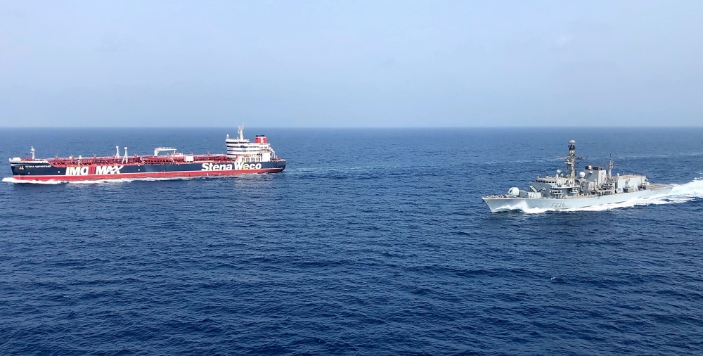 The HMS Montrose, right, accompany the Stena Important, left, vessel in the Gulf, is seen in this July 25, 2019 file photo. — AFP