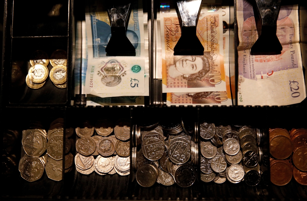 Pound Sterling notes and change are seen inside a cash register in a coffee shop in Manchester, Britain, in this Sept. 21, 2018 file photo. — Reuters