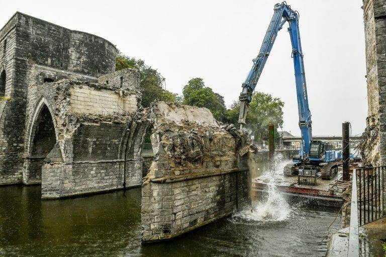 Workers press ahead with demolishing the arches which were rebuilt after World War II when British troops blew up the original medieval bridge over the Scheldt at Tournai. –Courtesy photo