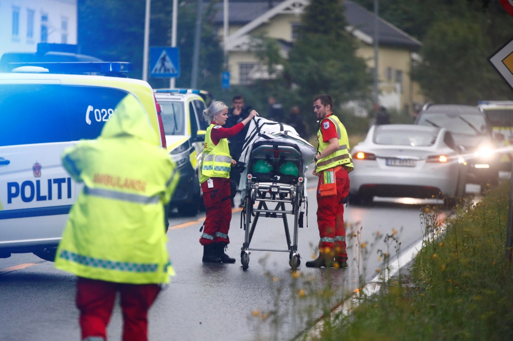 Emergency crews are seen near a stretcher after a shooting in Al-Noor Islamic center mosque, near Oslo, Norway on Saturday. -Reuters