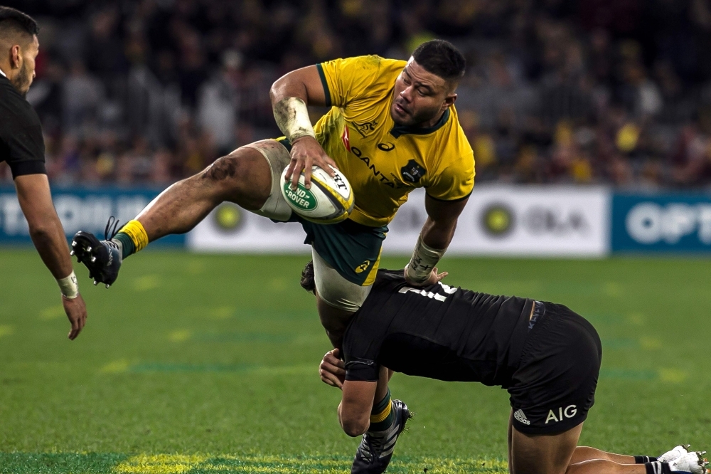 Australia’s Tolu Latu is tackled by New Zealand's Anton Lienert-Brown during the Rugby Championship Bledisloe Cup Test match between the Australian Wallabies and New Zealand All Blacks in Perth, Australia, on Saturday. — AFP
