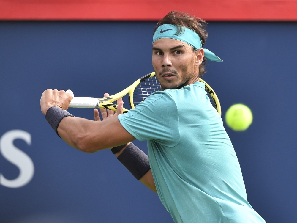 Rafael Nadal of Spain keeps his focus on the ball against Daniil Medvedev of Russia during the men's singles final on day 10 of the Rogers Cup at IGA Stadium in Montreal, Quebec, Canada, on Sunday. — AFP