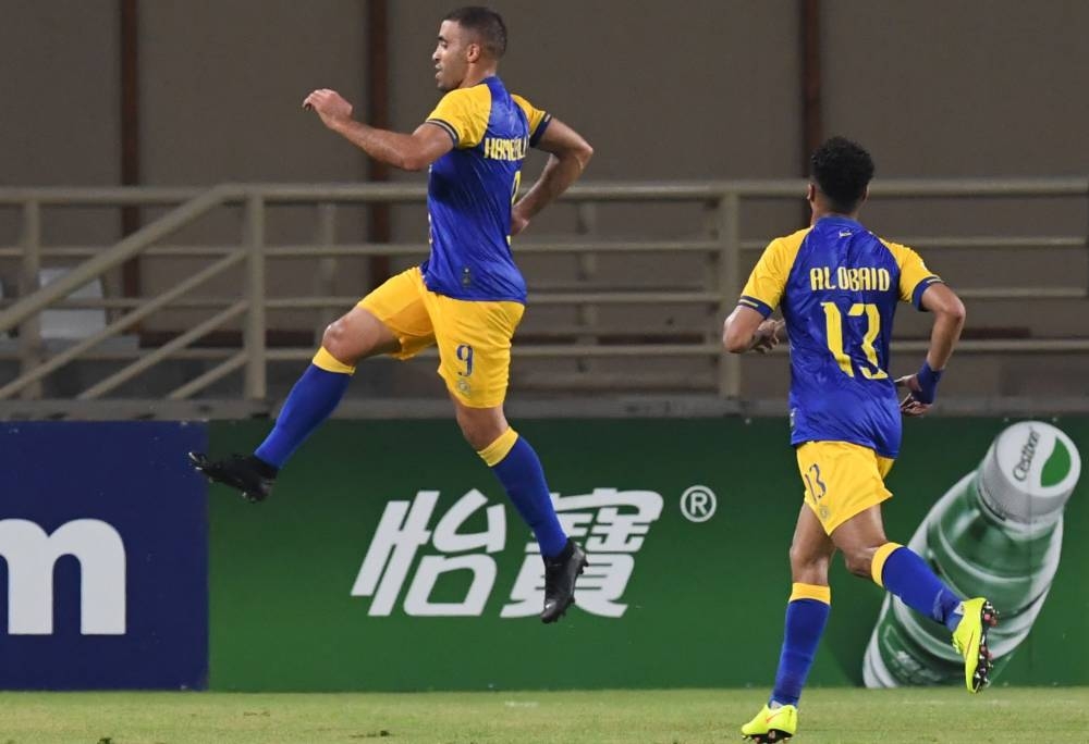 Al-Nassr forward Abderrazak Hamdallah celebrates after scoring a goal during the AFC Champions league round of 16 second leg football match against Al Wahda at the Al-Nahyan stadium in Abu Dhabi on Monday. — AFP