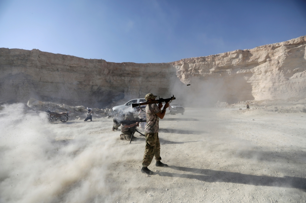 Fighters from Free Syrian Army (National Brigade) demonstrate their skills during a military display as part of a graduation ceremony in the Syrian city of Al-Bab, Syria,  in this Sept. 27, 2017 file photo. — Reuters