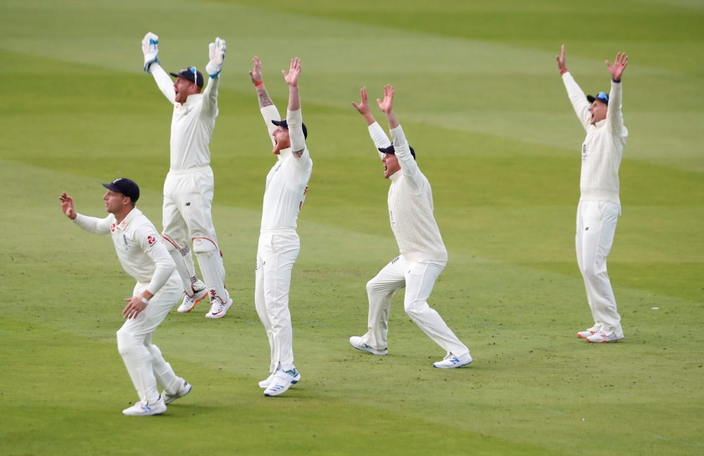 England's Jos Buttler, Jonny Bairstow, Jason Roy, Ben Stokes and Joe Root react in the field during second test match against Australia at Lord's Cricket Ground in London on Thursday. — Reuters