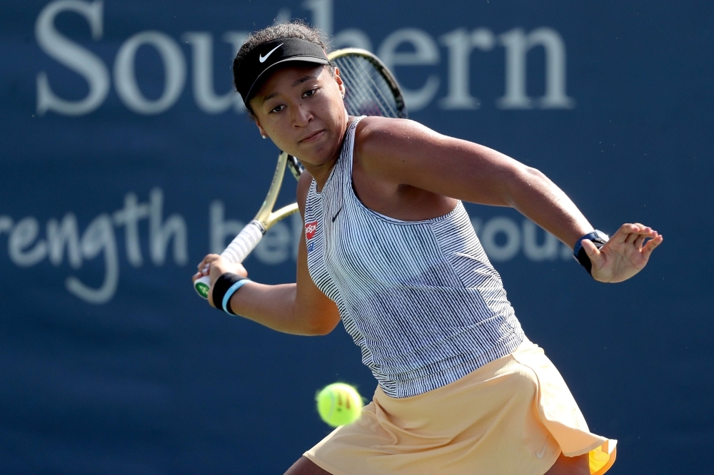 Naomi Osaka of Japan returns a shot to Su-Wei Hsieh of Taiwan during the Western & Southern Open at Lindner Family Tennis Center in Mason, Ohio, on Thursday. — AFP