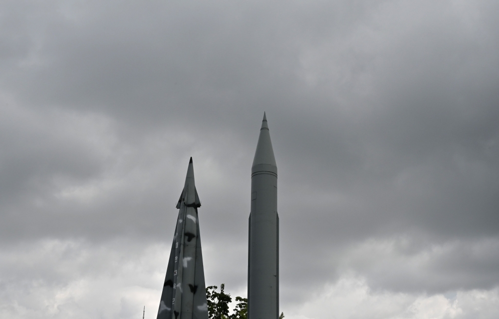 Replicas of a North Korean Scud-B missile, right, and South Korea's Nike missile, left, are displayed at the Korean War Memorial in Seoul on Friday. — AFP