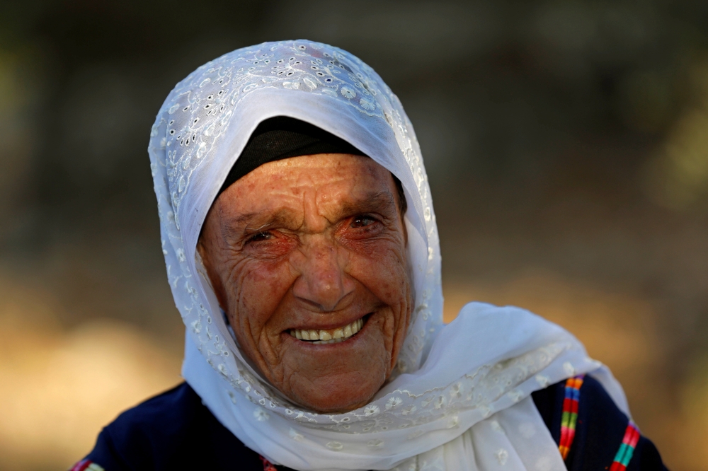 Muftia, the grandmother of US congresswoman Rashida Tlaib, looks on outside her house in the village of Beit Ur Al-Fauqa in the Israeli-occupied West Bank on Friday. — Reuters