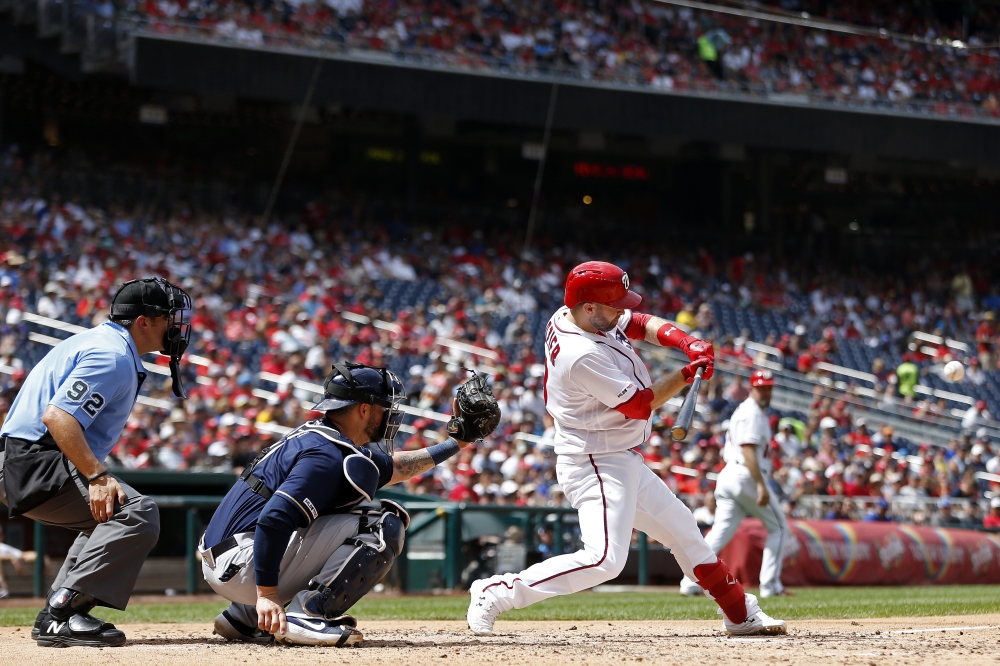 Washington Nationals second baseman Brian Dozier hits a three run home run against the Milwaukee Brewers in the third inning at Nationals Park, Washington, DC, USA, on Sunday. — Reuters