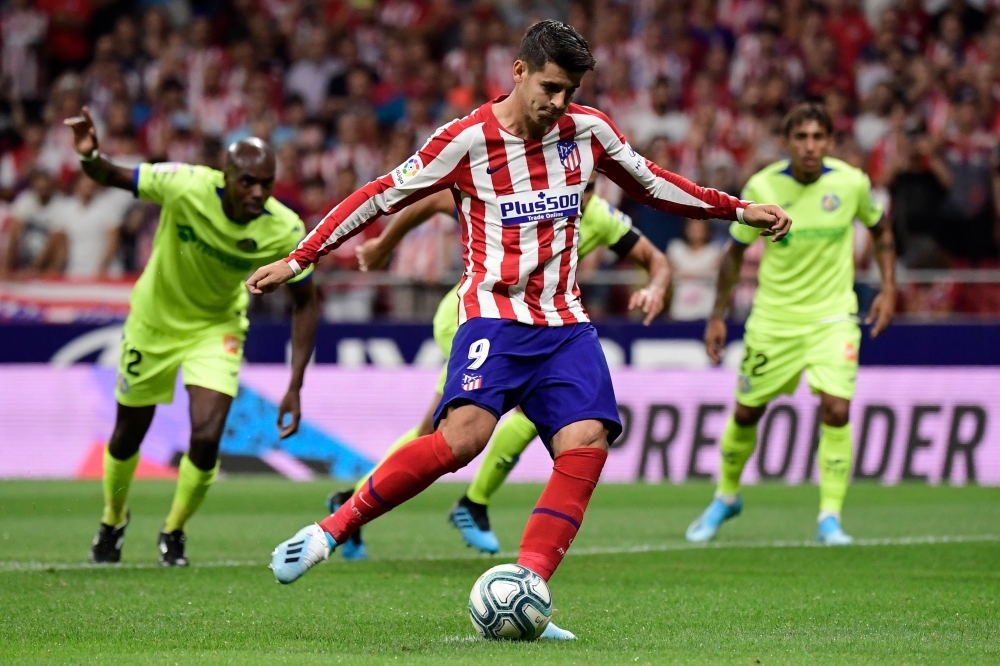 Atletico Madrid's Spanish forward Alvaro Morata takes a penalty kick but fails to score during the Spanish League football match between Atletico Madrid and Getafe at the Wanda Metropolitan Stadium in Madrid, on Sunday. — AFP