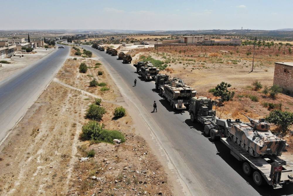 A convoy of Turkish military vehicles is pictured near the town of Maar Hitat in northern Syria's Idlib province, Monday. — AFP