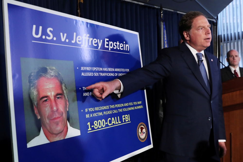 Geoffrey Berman, United States Attorney for the Southern District of New York, points to a photograph of Jeffrey Epstein as he announces the financier's charges of sex trafficking of minors and conspiracy to commit sex trafficking of minors, in New York, in this July 8, 2019 file photo. — Reuters