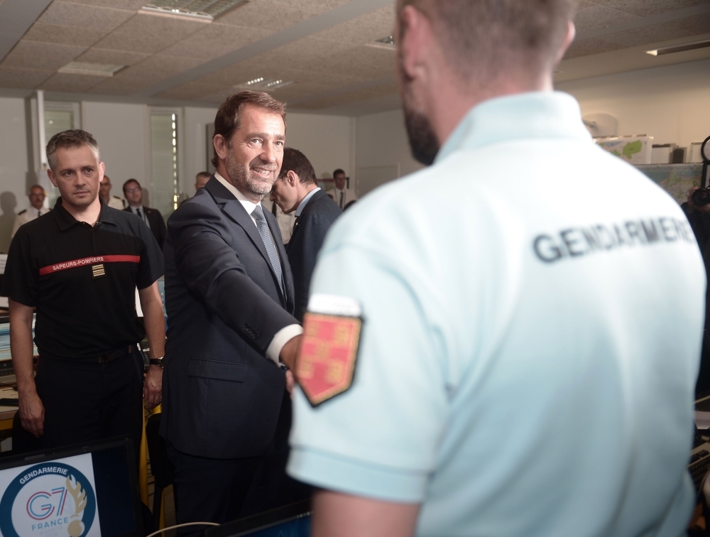 French Interior Minister Christophe Castaner shakes hands with a Gendarme as he arrives at the G7 Interministerial command headquarters (Poste de Commandement Interministeriel - PCI) set in the Fall college in Biarritz on Tuesday ahead of the 45th Group of Seven (G7) nations annual summit which will take place from August 24-26, 2019 in the seaside resort of Biarritz. — AFP