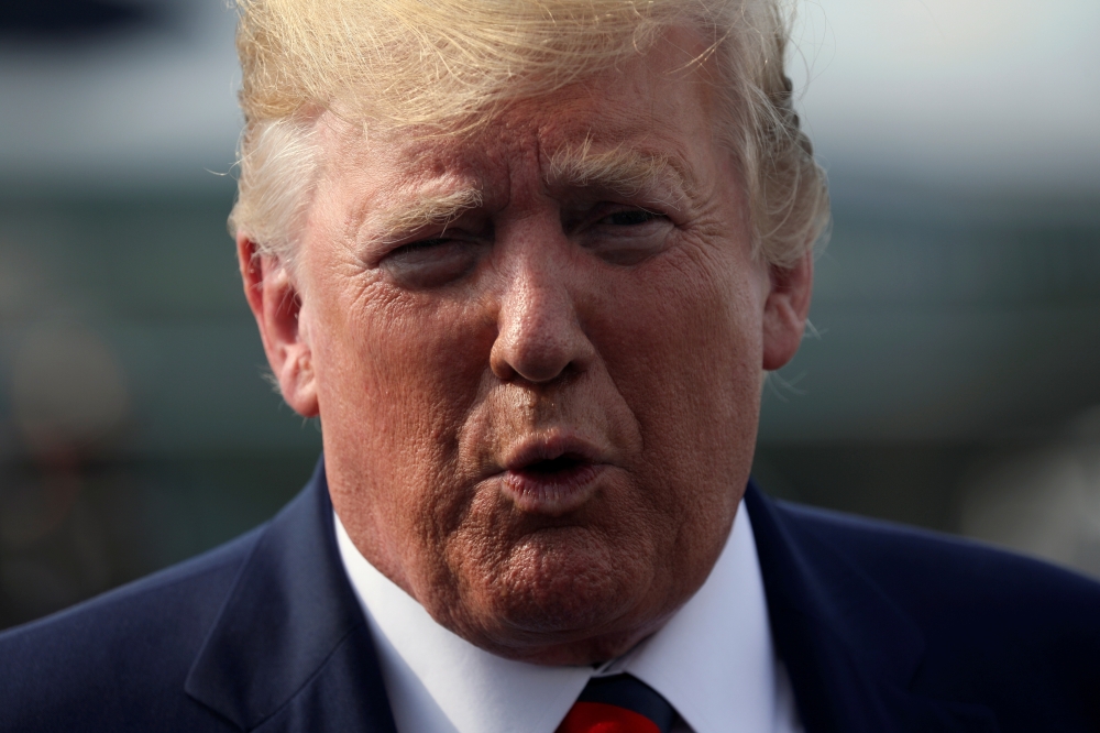 US President Donald Trump speaks to reporters before boarding Air Force One to return to Washington from Morristown Municipal Airport in Morristown, New Jersey, in this Aug. 18, 2019 file photo. — Reuters