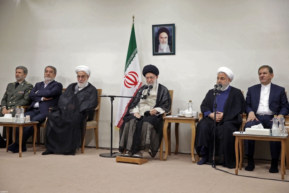 A handout picture released by the official website of Iran's Supreme Leader Ayatollah Ali Khamenei shows Khamenei, center, speaking alongside Iran's President Hassan Rouhani, center right, during a Cabinet meeting in Tehran on Wednesday. — AFP