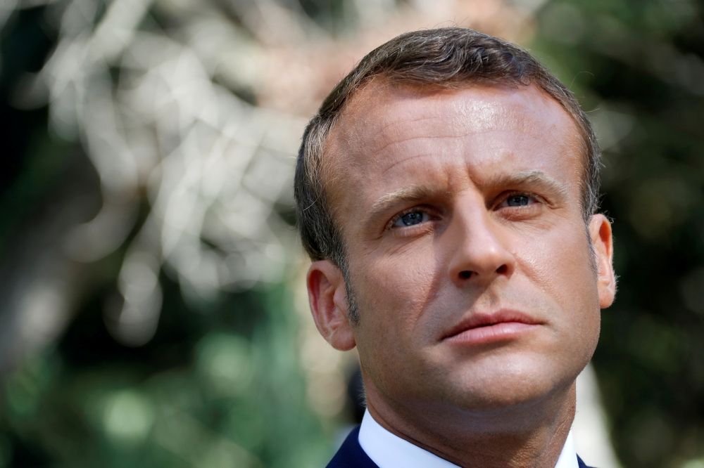 French President Emmanuel Macron reacts as he arrives at a ceremony marking the 75th anniversary of the Allied landings in Provence in World War II which helped liberate southern France, in Boulouris, France, in this Aug. 15, 2019 file photo.  — Reuters