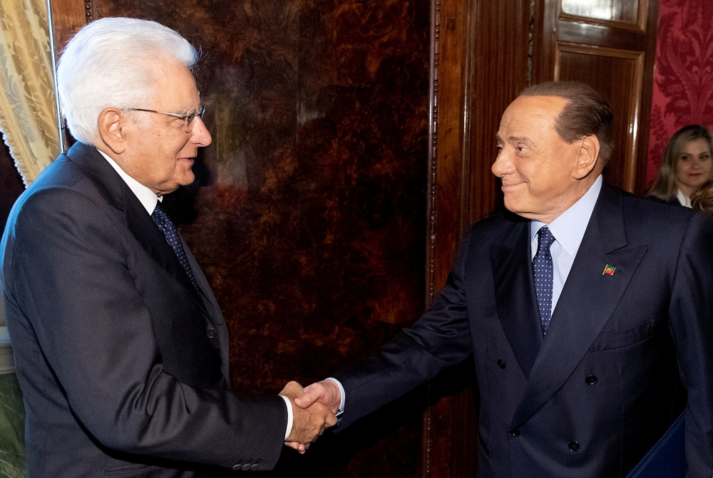 Forza Italia leader Silvio Berlusconi, right, meets with Italian President Sergio Mattarella for consultations in Rome, Italy, on Thursday. — Reuters