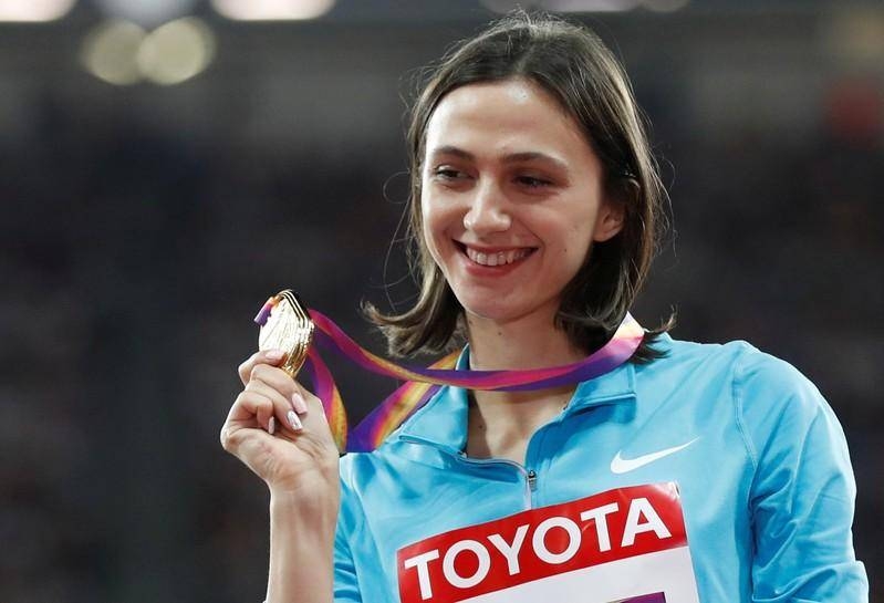 Russian high jumper Maria Lasitskene poses with the Gold medal at World Athletics Championships in London, in this Aug. 12, 2017 file photo. — Reuters