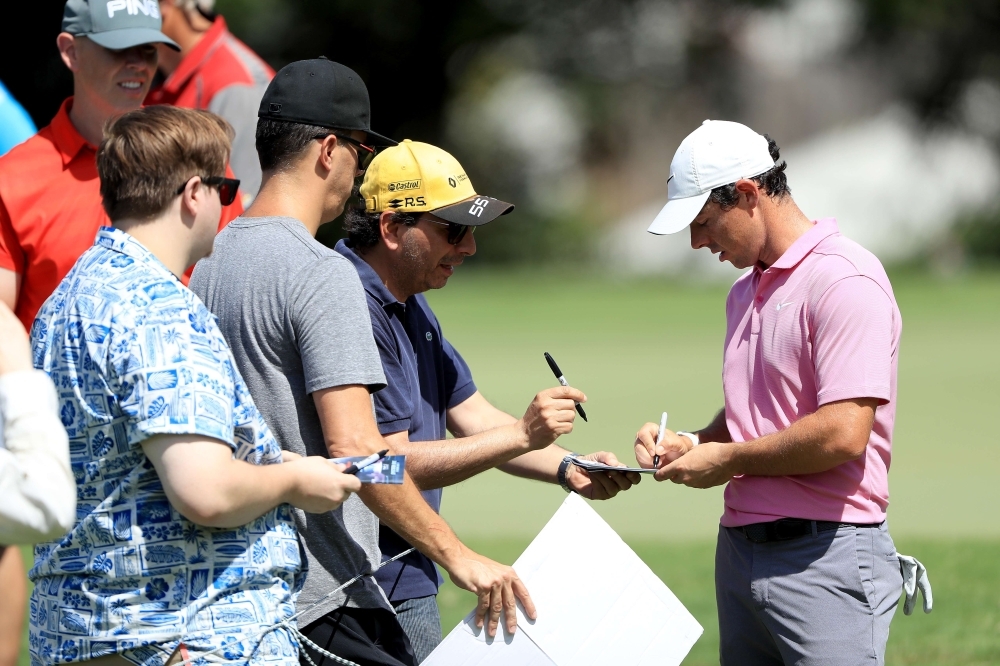 Rory McIlroy of Northern Ireland signs autographs during a practice round prior to the TOUR Championship at East Lake Golf Club in Atlanta, Georgia, on Wednesday. — AFP