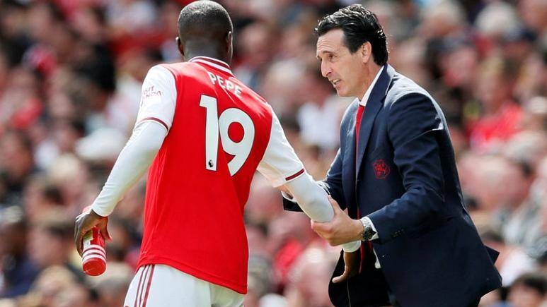 Arsenal's Nicolas Pepe with manager Unai Emery during the Premier League match against Burnley at Emirates Stadium, London, Britain, in this Aug. 17, 2019 file photo. — Reuters