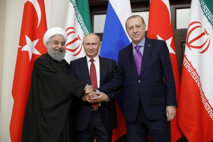 Iran's President Hassan Rouhani, left, Russia's Vladimir Putin, center, and Turkey's Tayyip Erdogan meet in Sochi, Russia, in this Nov. 22, 2017 file photo. — Reuters