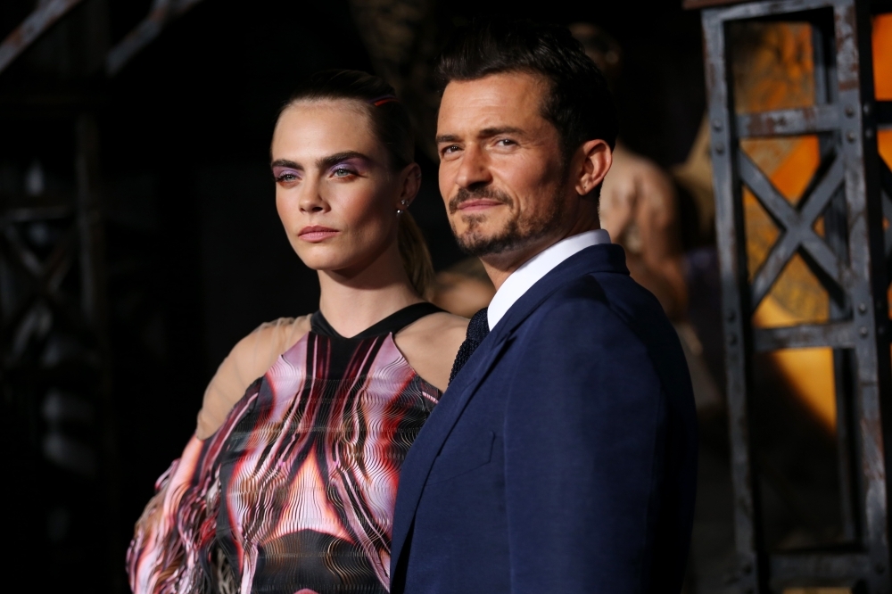 Cara Delevingne, right, and Orlando Bloom attend the LA premiere of Amazon's 