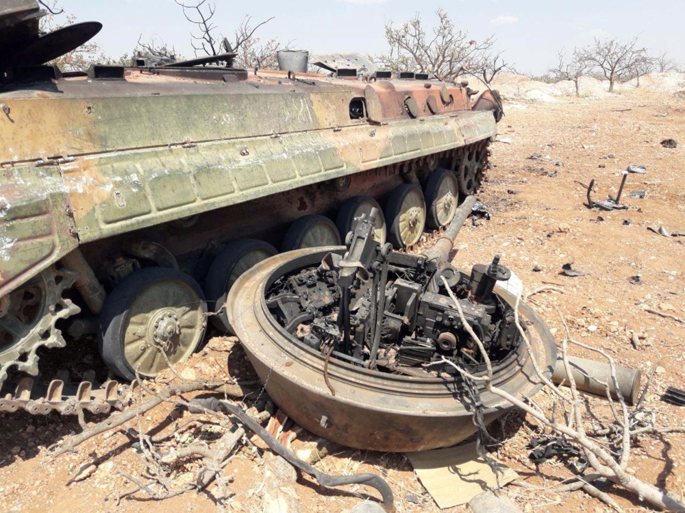 A damaged military tank is seen in Idlib countryside, Syria in this handout released by SANA, on Thursday. — Reuters