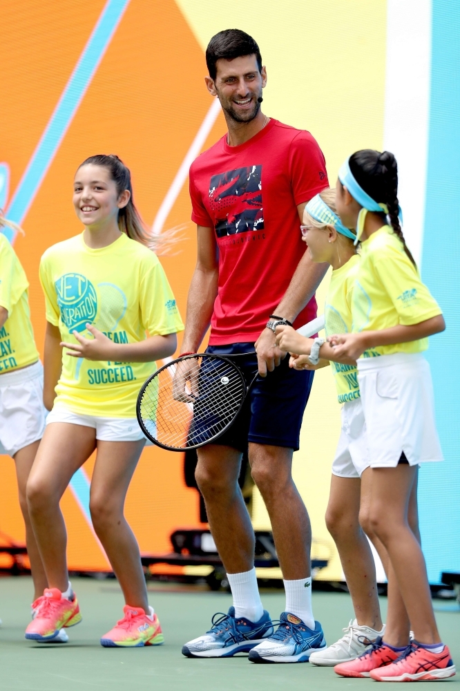Novak Djokovic Plays With Baseball Bat & More at Arthur Ashe Kids' Day –  Footwear News