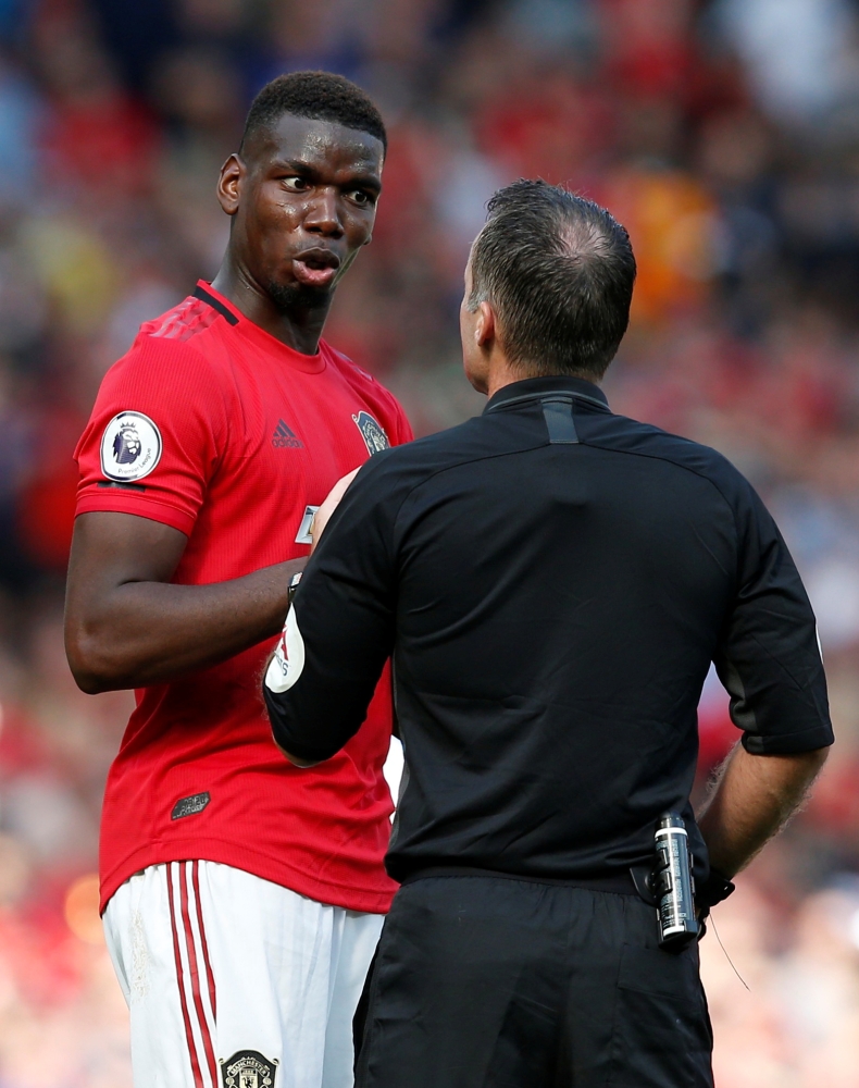 Manchester United's Paul Pogba reacts to referee Paul Tierney during Premier League matvh against Crystal Palace at Old Trafford, Manchester, Britain, on Sunday. — Reuters