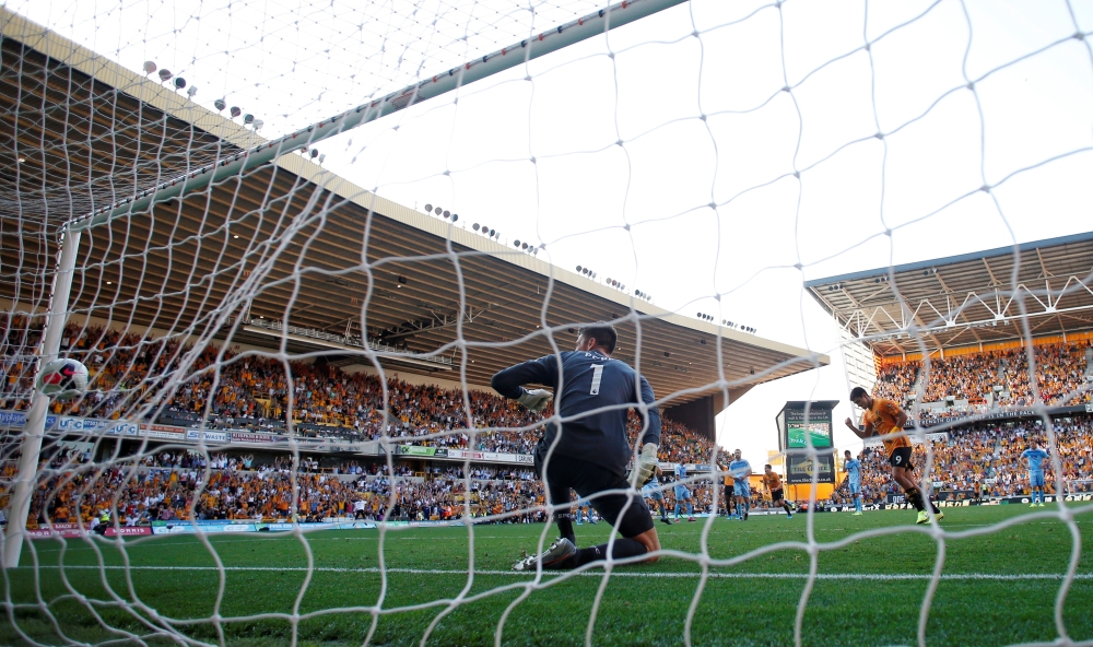 Wolverhampton Wanderers' Raul Jimenez scores their first goal from the penalty spot during the Premier League match against Burnley at Molineux Stadium, Wolverhampton, Britain, on Sunday. — Reuters