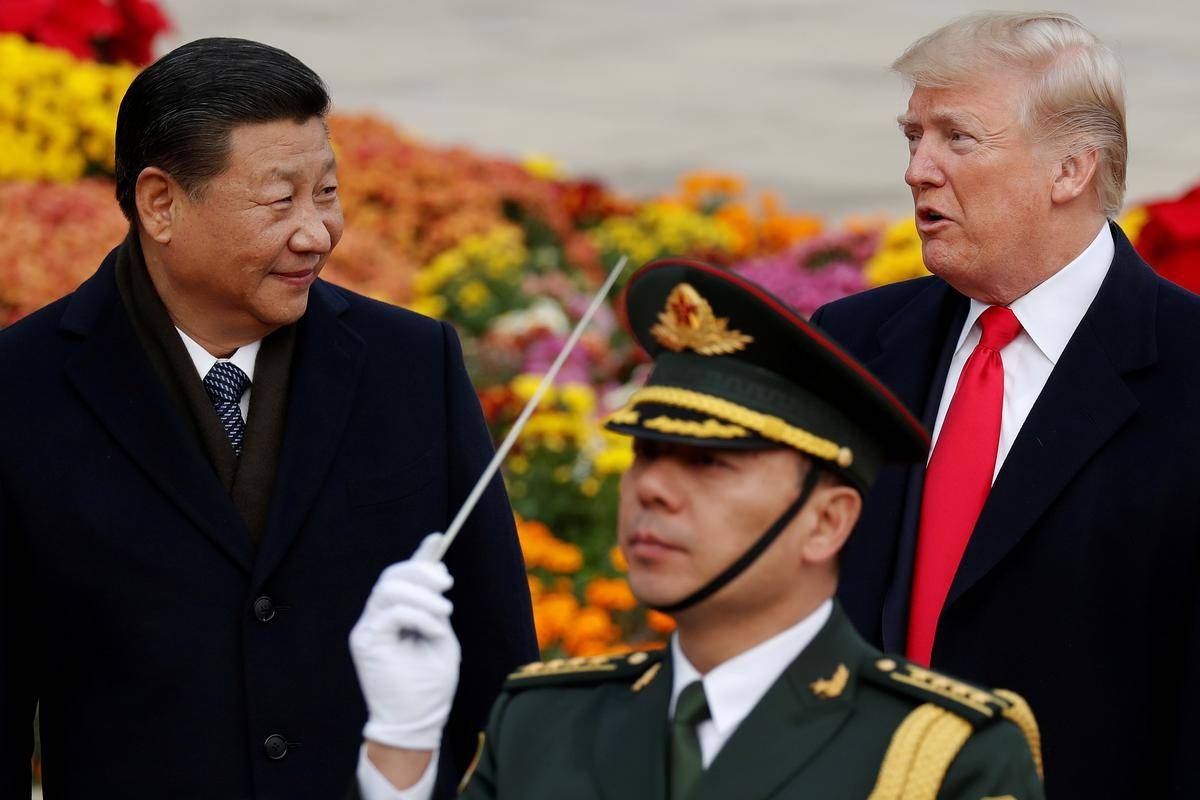 US President Donald Trump takes part in a welcoming ceremony with China's President Xi Jinping at the Great Hall of the People in Beijing, China, November 9, 2017. -Reuters