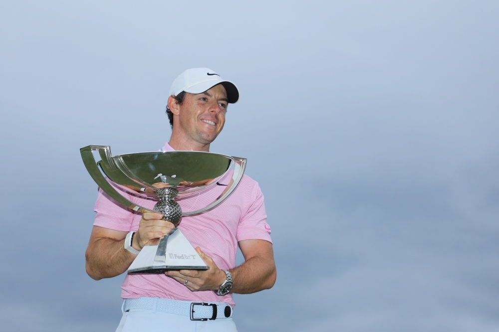 Rory McIlroy of Northern Ireland celebrates with the FedExCup trophy after winning during the final round of the TOUR Championship at East Lake Golf Club in Atlanta, Georgia, on Sunday. — AFP